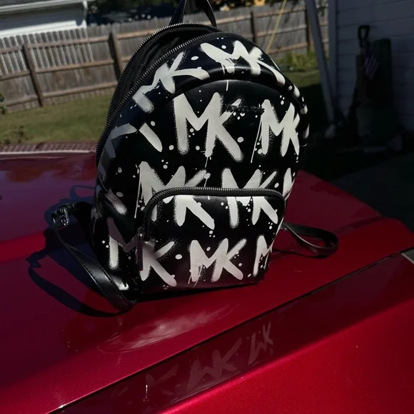 Two Michael Kors backpacks very good condition. Original tags with both bags!